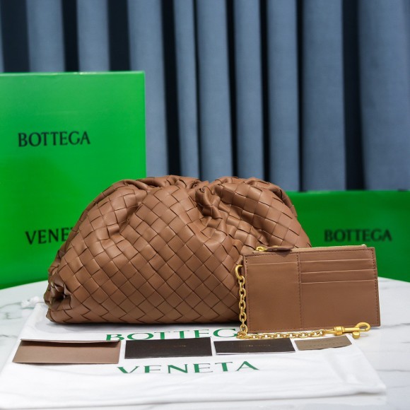 Bo*te*ga ve*ne*ta large pouch clutch bag in caramel intrecciato lambskin