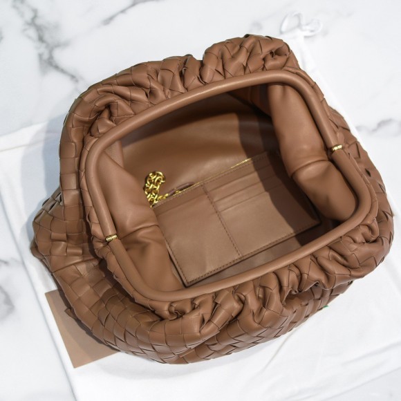 Bo*te*ga ve*ne*ta large pouch clutch bag in caramel intrecciato lambskin