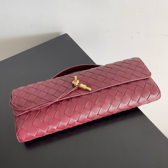 Bo*te*ga ve*ne*ta andiamo clutch with handle in barolo intrecciato lambskin