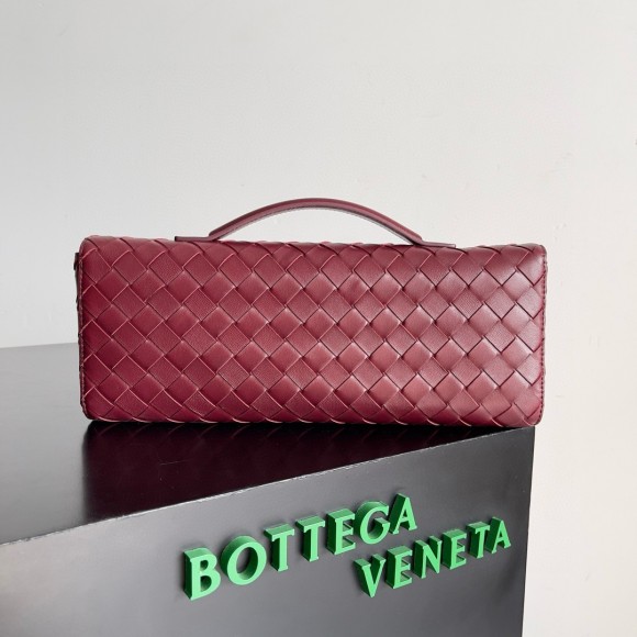 Bo*te*ga ve*ne*ta andiamo clutch with handle in barolo intrecciato lambskin