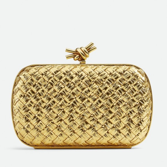 Bo*te*ga ve*ne*ta knot minaudiere clutch in gold intreccio laminated leather