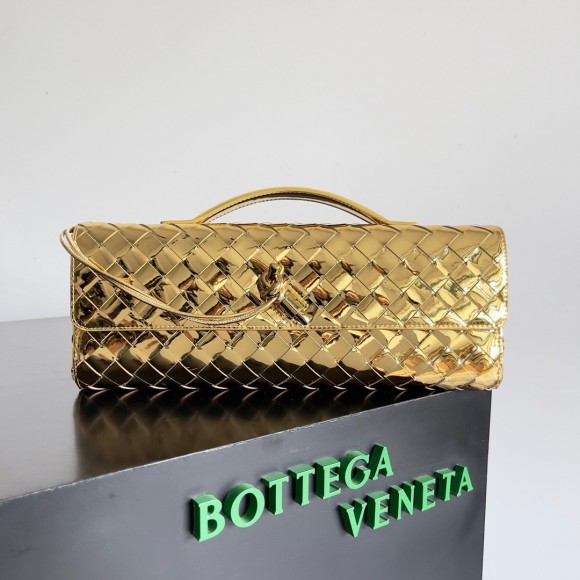 Bo*te*ga ve*ne*ta andiamo clutch with handle in gold metallic leather