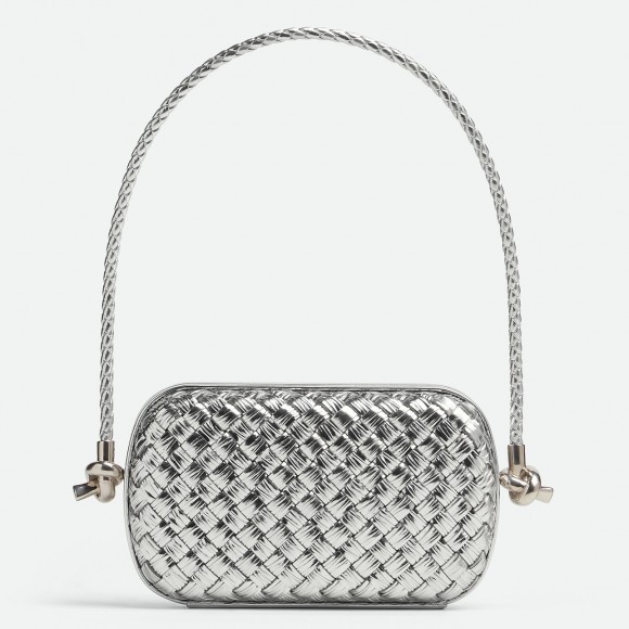 Bo*te*ga ve*ne*ta knot minaudiere on strap in silver intreccio laminated leather