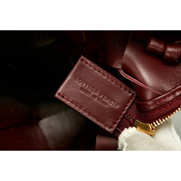 Bo*te*ga ve*ne*ta mini cassette camera bag in bordeaux lambskin