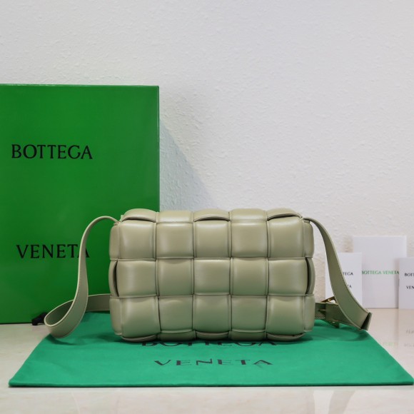 Bo*te*ga ve*ne*ta padded cassette bag in travertine intrecciato lambskin