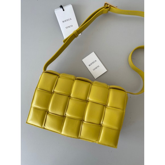 Bo*te*ga ve*ne*ta padded cassette bag in yellow intrecciato lambskin