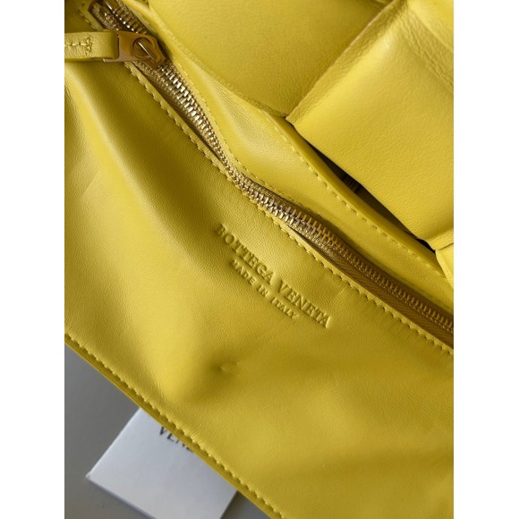 Bo*te*ga ve*ne*ta padded cassette bag in yellow intrecciato lambskin