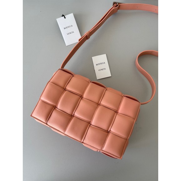 Bo*te*ga ve*ne*ta padded cassette bag in peachy intrecciato lambskin