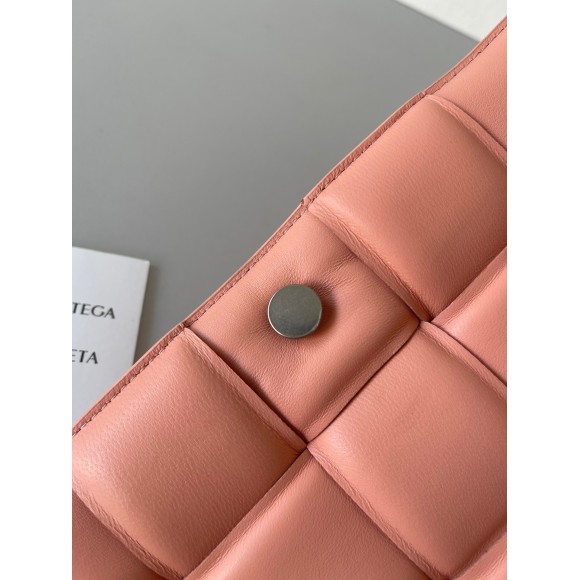 Bo*te*ga ve*ne*ta padded cassette bag in peachy intrecciato lambskin