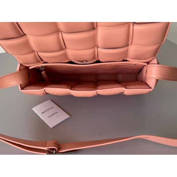 Bo*te*ga ve*ne*ta padded cassette bag in peachy intrecciato lambskin