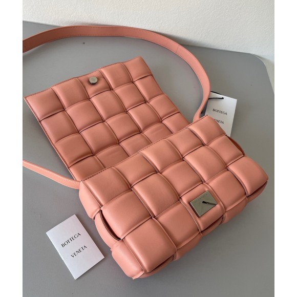 Bo*te*ga ve*ne*ta padded cassette bag in peachy intrecciato lambskin