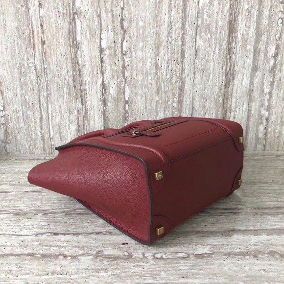 Ce**e micro luggage tote bag in dark red drummed calfskin