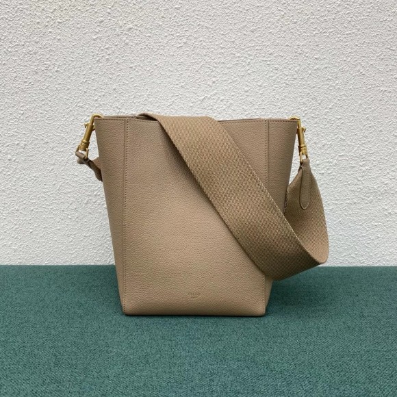 Ce**e sangle small bucket bag in taupe calfskin