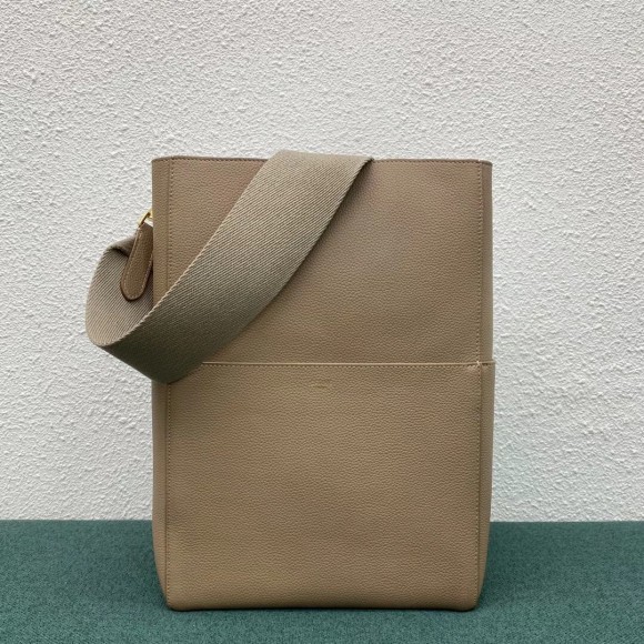 Ce**e sangle bucket bag in taupe grained calfskin