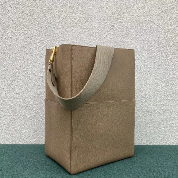 Ce**e sangle bucket bag in taupe grained calfskin