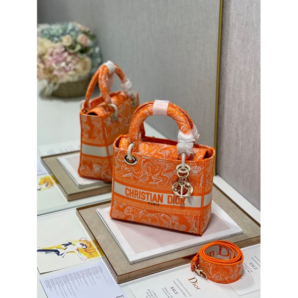 D*or lady d-lite medium bag in fluorescent orange toile de jouy reverse embroidery