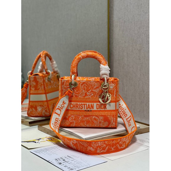 D*or lady d-lite medium bag in fluorescent orange toile de jouy reverse embroidery