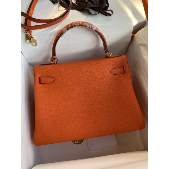 H**mes kelly retourne 32 handmade bag in orange clemence leather