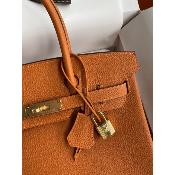 H**mes birkin 25 retourne handmade bag in orange clemence leather