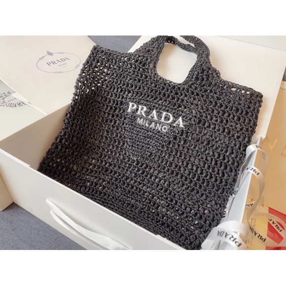 Pra*a large tote bag in black woven raffia