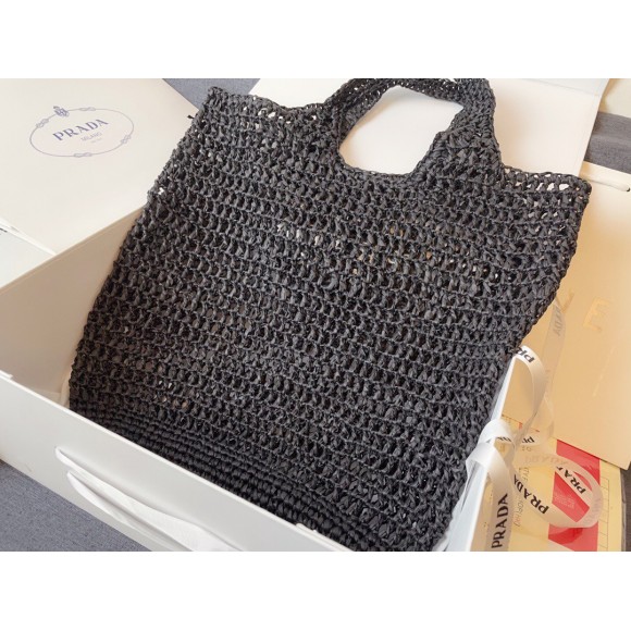 Pra*a large tote bag in black woven raffia