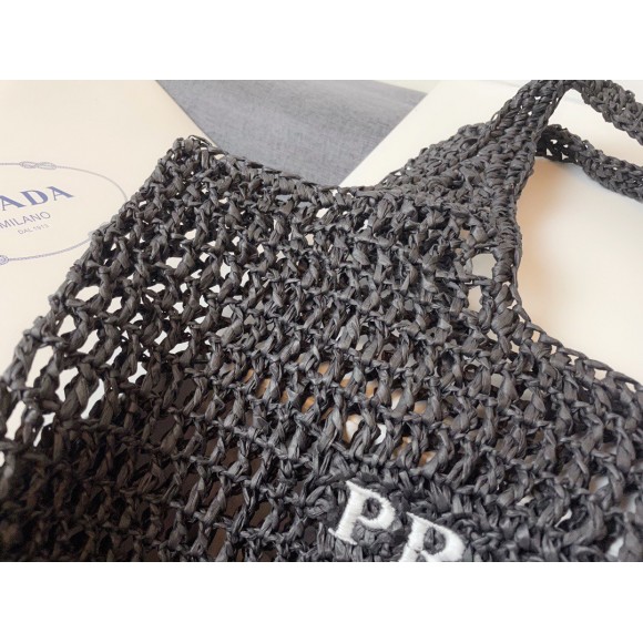 Pra*a large tote bag in black woven raffia